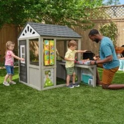 KidKraft Patio Party Wooden Outdoor Playhouse With Spinner Block Puzzle - 14pc